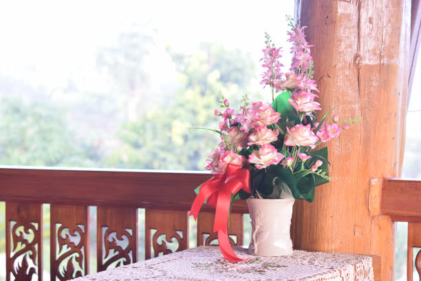 Detail of hanging flower pots on fence