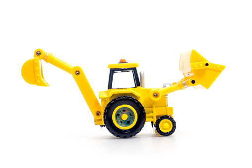 Tractor with backhoe and loader toy isolated on white bacground . Children's Developmental, creative thinking toy car.