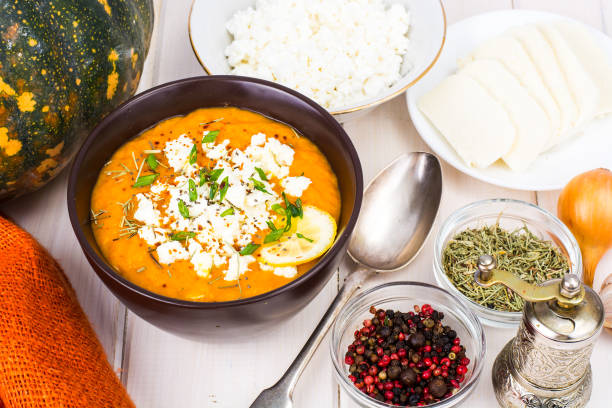istock Pumpkin cream soup with goat cheese 940948986