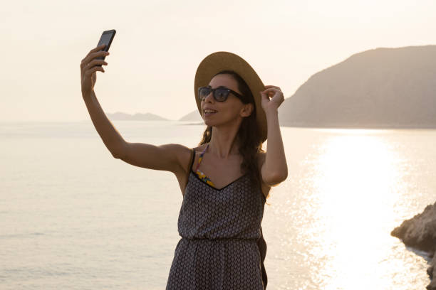 istock Traveler Taking Selfie with Ocean View 940950436