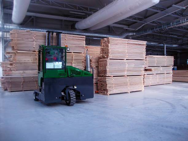 istock Forklift works in factory 940956684