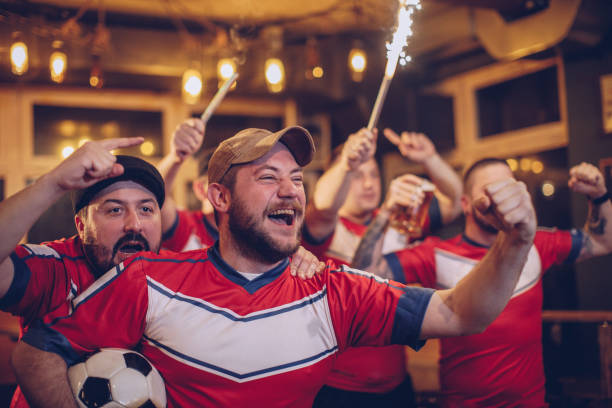 istock Soccer fans at pub 940961206