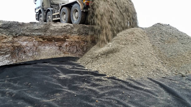 istock Truck unload gravel 940962524