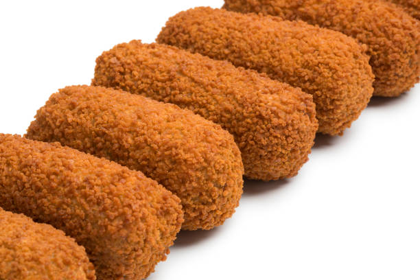 istock Row of deep fried Dutch kroketten 940966888