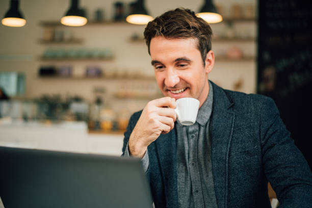 istock Handsome man enjoys a cup of hot coffee 940967008