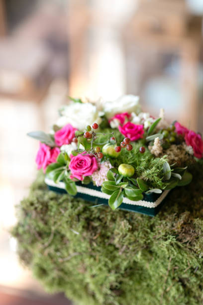 istock ring pad. table setting. Wedding decor in the magic forest for a loving couple. Pink and green colors. 940967982