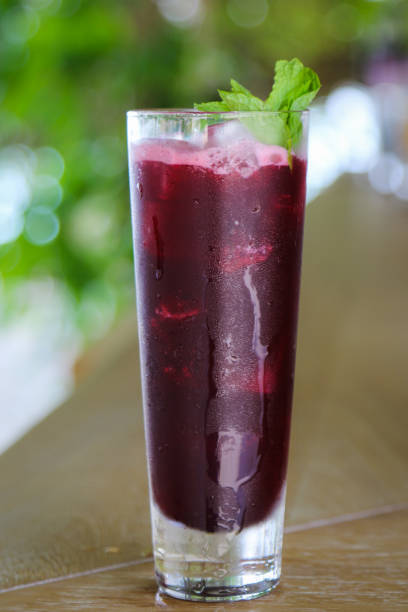 istock Purple red cocktail in tall glass 940969210