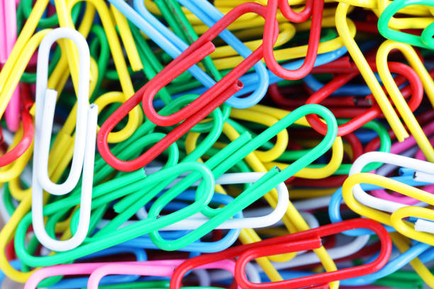 istock close up of colorful paper clips background 940976578