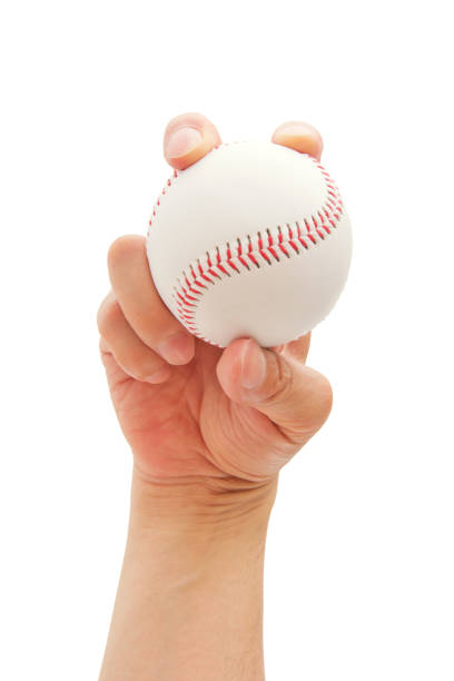 istock How to grip a baseball properly, isolated on white background 940980744