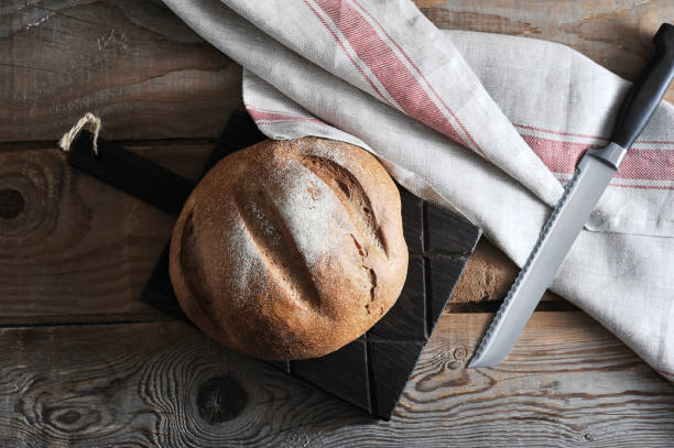 istock whole rye bread on wooden Board 940981498