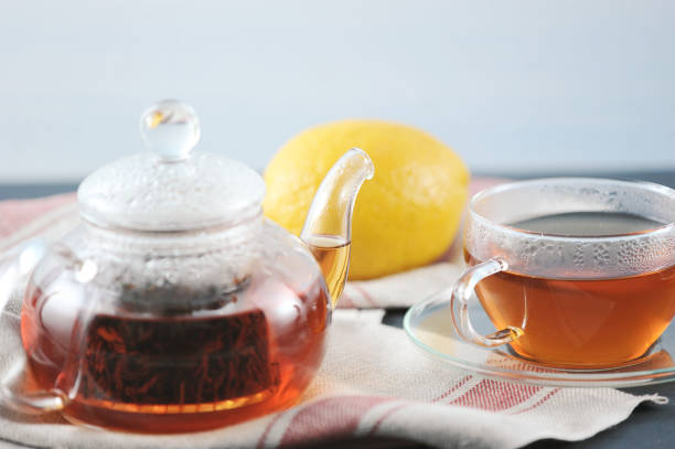 istock black Bayh tea with lemon in glass teapot 940982488