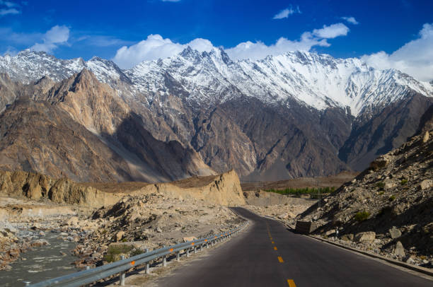 Karakoram Highway with mountain in background Karakoram Highway with mountain in background karakoram range stock pictures, royalty-free photos & images