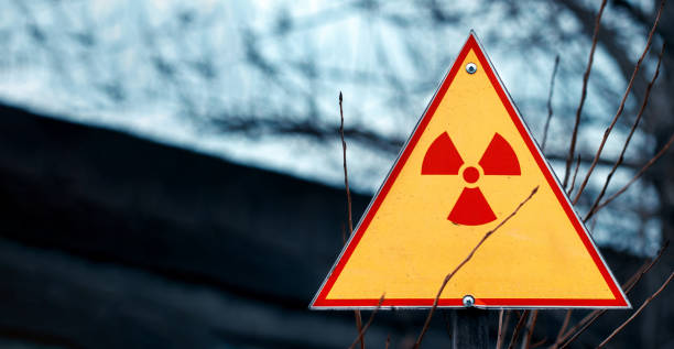 sign of radiation hazard against radioactive waste, picture with a place for your text, copy space, your text here - nuclear weapons imagens e fotografias de stock