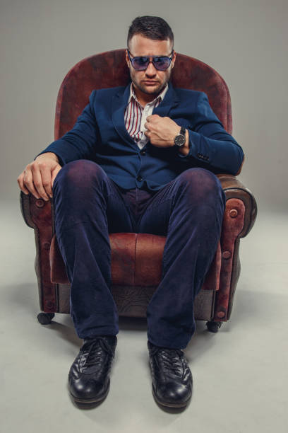 istock Serious bearded man in a suit and sunglasses. 940993100