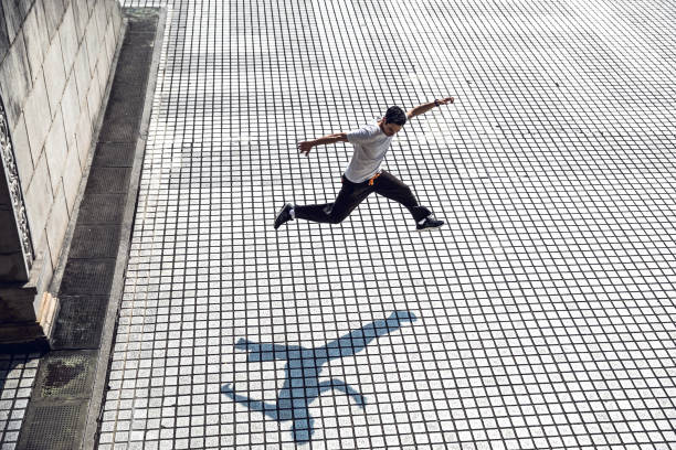 Parkour - Man in jumping and exercising on free running in Taiwan - Taipei Parkour - Man in jumping and exercising on free running in Taiwan - Taipei free running stock pictures, royalty-free photos & images