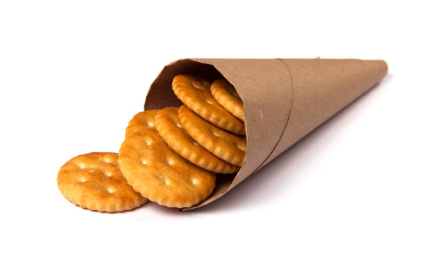 istock Biscuit cracker yellow round in package isolated on white background 940995470