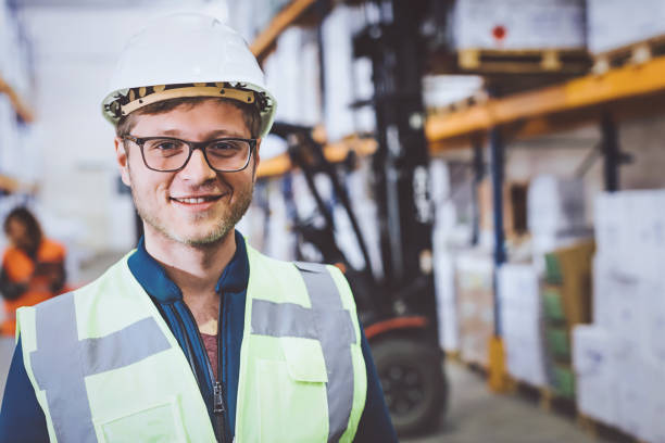 istock Portrait of industry manual worker in warehouse 940996394