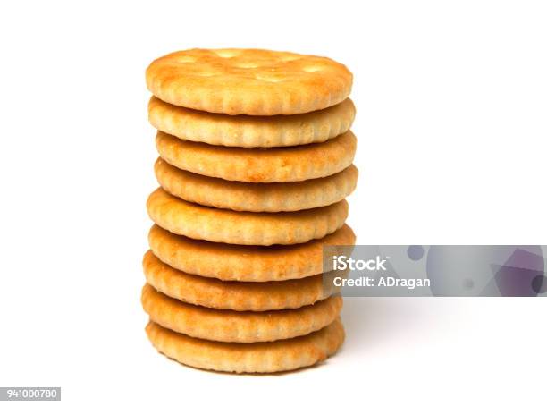 Biscuit Cracker Stack Of Yellow Round Isolated On White Background Stock Photo - Download Image Now