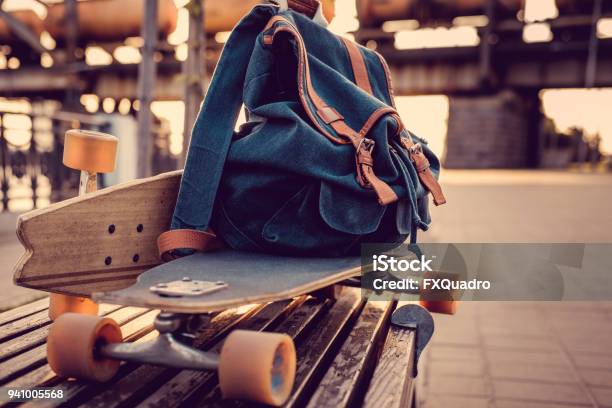 Longboard With Backpack On It Stock Photo - Download Image Now - Longboard Skating, Backpack, Skateboarding