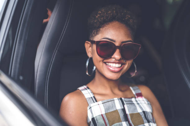istock Afro young descent woman inside a luxury car 941011846