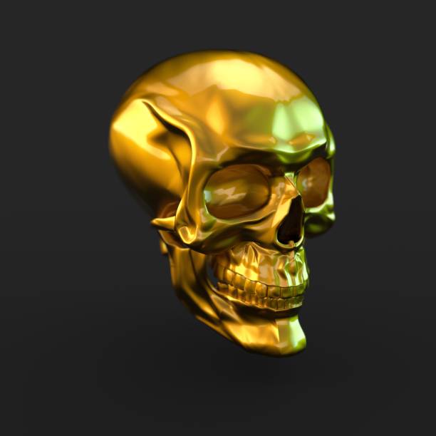 istock Golden glossy skull with light reflections isolated on black background 941013262
