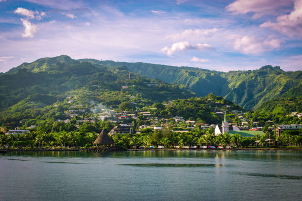 Papeete, Tahiti, French Polynesia Landscape of Tahiti with mountains and village close to the port of Papeete, French Polynesia. Cruise and honeymoon destination. french polynesia stock pictures, royalty-free photos & images