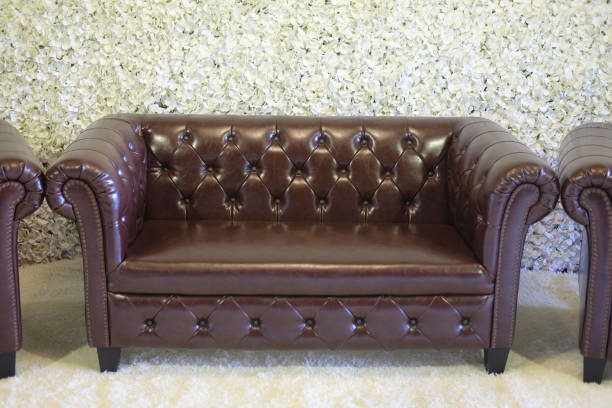 Classic brown sofa in wedding with petal flower background