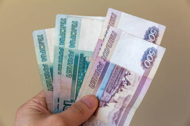 istock Russian money in a man's hand 941021096