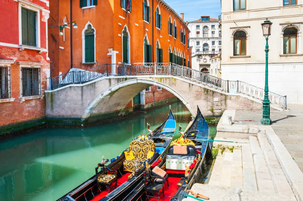 istock Scenic canal with godolas in Venice, Italy. 941026026