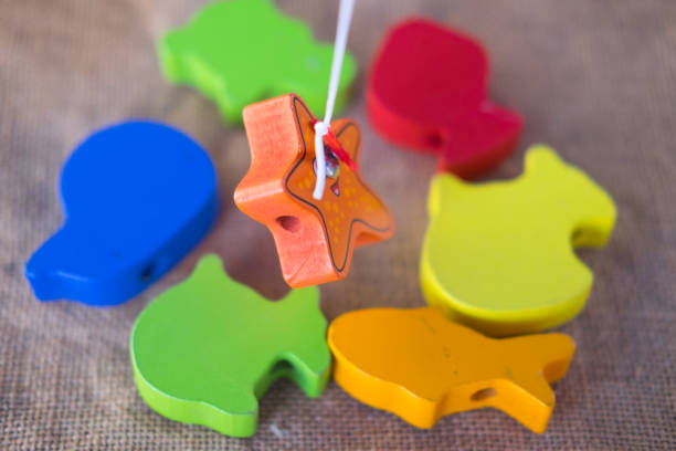 istock Wooden fish toy for kids on the table 941029814