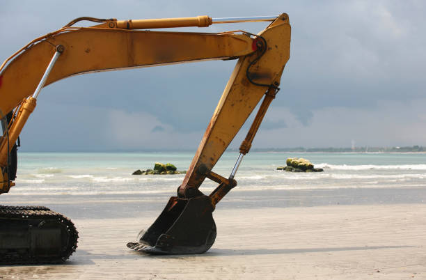 Durban, South Africa - July  2, 2014; Payloader works on beach on Golden Mile beachfront in Durban, South Africa