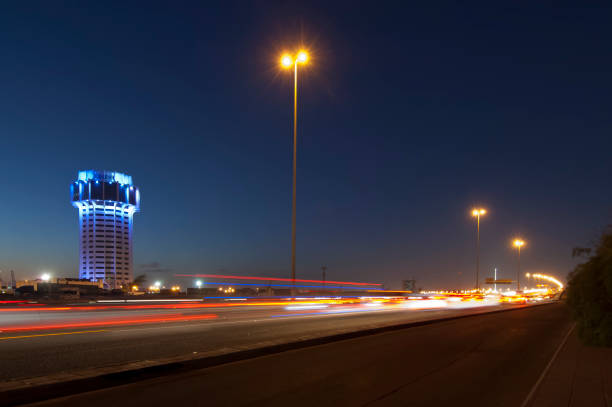 Jeddah water tower at night, with car lights motion on the street. Saudi Arabia stock photo