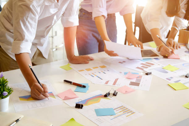 istock Young group of workers discussing business plans. 941041140