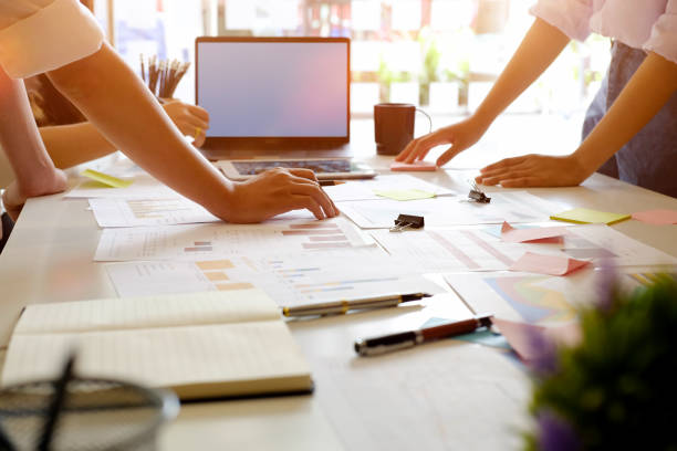 istock Young group of workers discussing business plans. 941041152