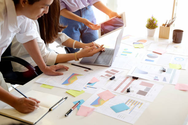 istock Young group of workers discussing business plans. 941041172