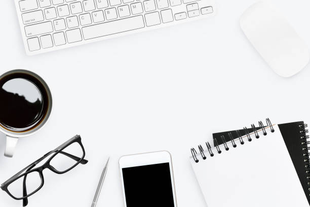 istock White office desk with supplies. Top view with copy space; flat lay. 941041376