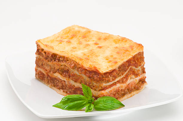 istock Piece of lasagna on a white plate with garnish 94104274