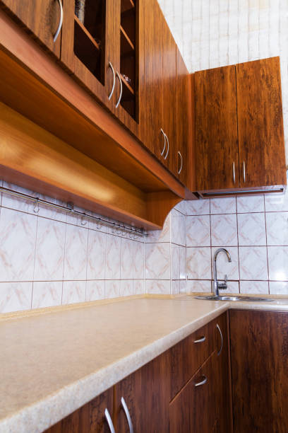 istock Luxury pine wood beautiful custom kitchen interior design with island and granite. 941044704