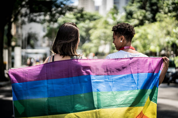 istock Lesbian Couple with Rainbow Flag 941051690