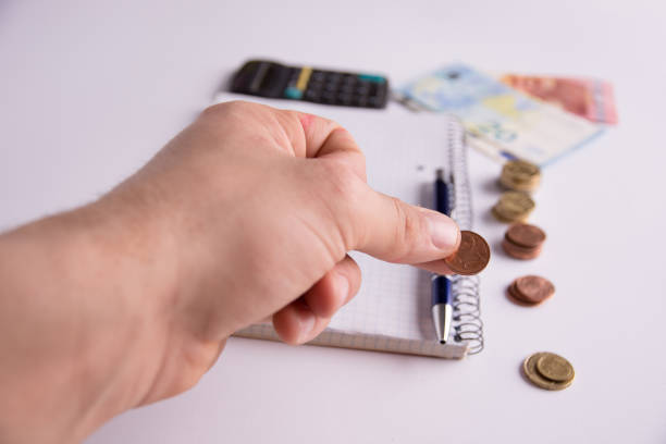 istock concept of calculating savings on a white background 941051806
