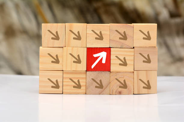 istock Growing Up concept with wood blocks arrow going upward 941052300