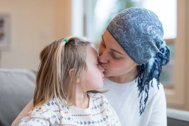 Young mom with cancer holds her daughter