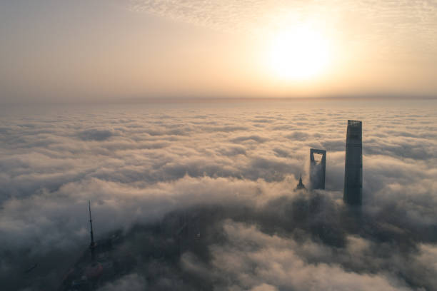 the skyscrapers in Shanghai Lujiazui above the advection fog at sunrise
