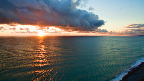 istock Sea landscape with dramatic sunset views and a large cloud. 941062024
