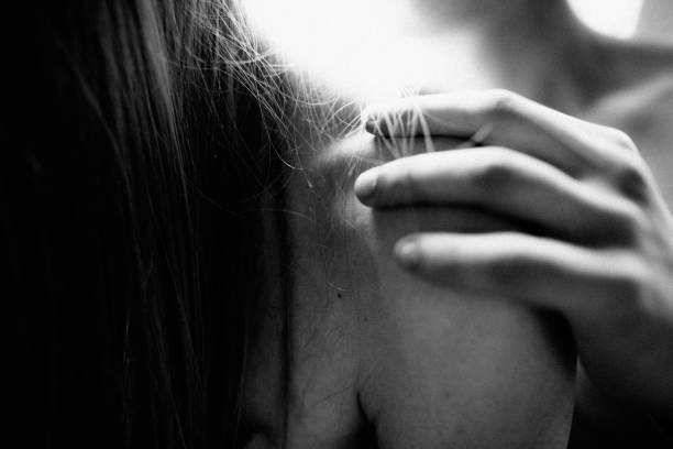 Close-up of a young woman's face. She screams enthusiastically and has her eyes wide open. What a great moment.