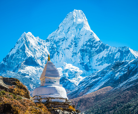 Buddhist stupa shrine below Ama Dablam mountain peak Himalayas Nepal