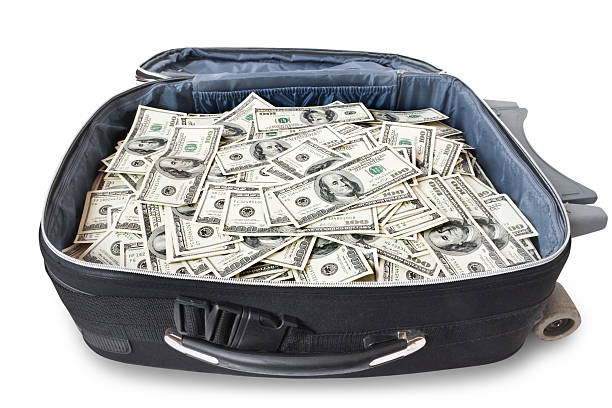 istock lot of money in a suitcase 94106784