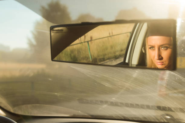 istock Eyes in the rearview mirror 941071476