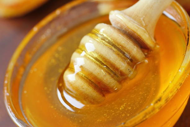 istock Sweet honey in glass bowl 941073134