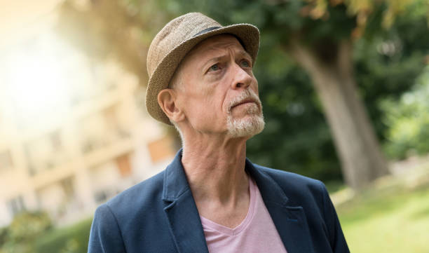 istock Portrait of handsome mature man, light effect 941075846
